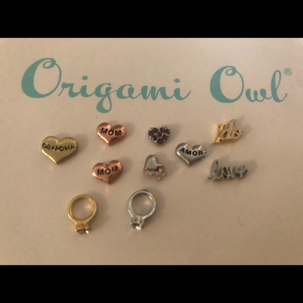 51 mixed Mixed Origami Owl charms and then some.